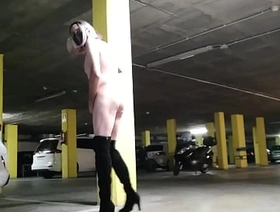 Naked sissy masturbating in a dark public space