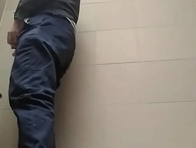 Young guy peeing with his uncut cock in a highway toilet